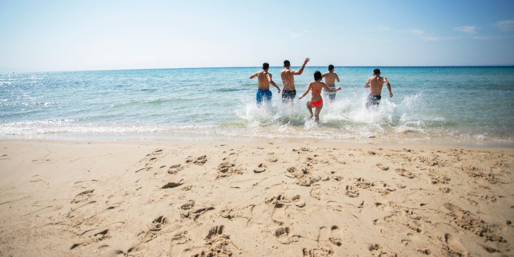Swim Near Lifeguards And Follow Flag Warnings
